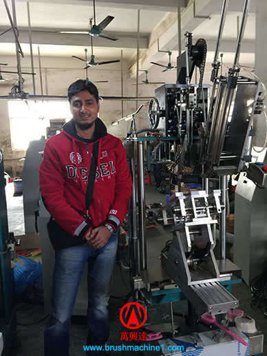 Mr Azhar with his 3-axis tufting machine.jpg