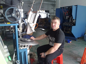 Mr Gavrilov is testing the disk brush machine.jpg